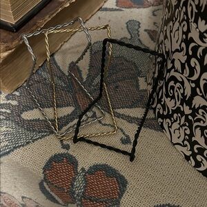 Black gold and silver art holders